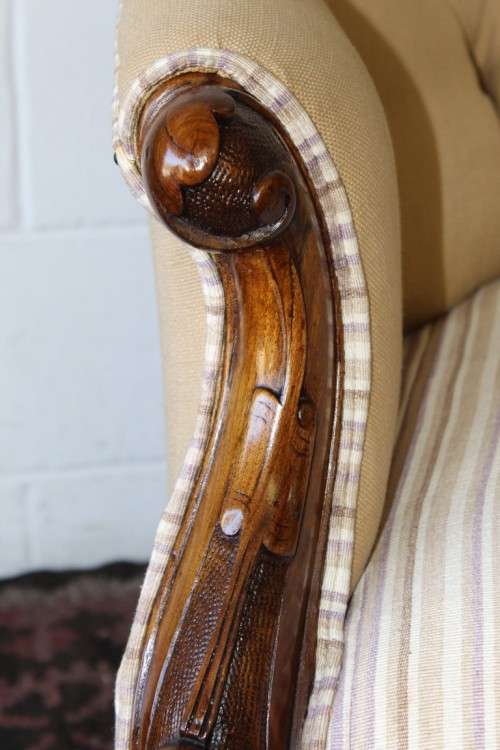 An incredible antique Victorian solid hand carved Mahogany upholstered Chaise Lounge on castors