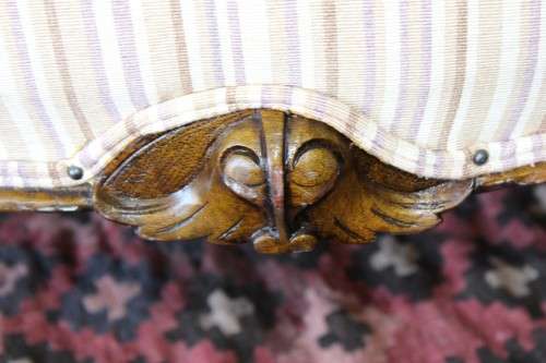 An incredible antique Victorian solid hand carved Mahogany upholstered Chaise Lounge on castors