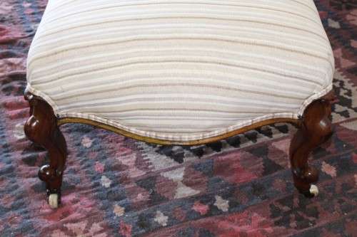 An incredible antique Victorian solid hand carved Mahogany upholstered Chaise Lounge on castors