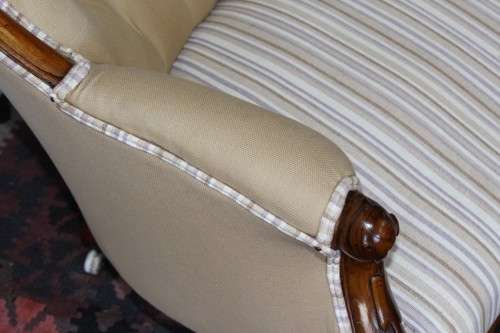 An incredible antique Victorian solid hand carved Mahogany upholstered Chaise Lounge on castors
