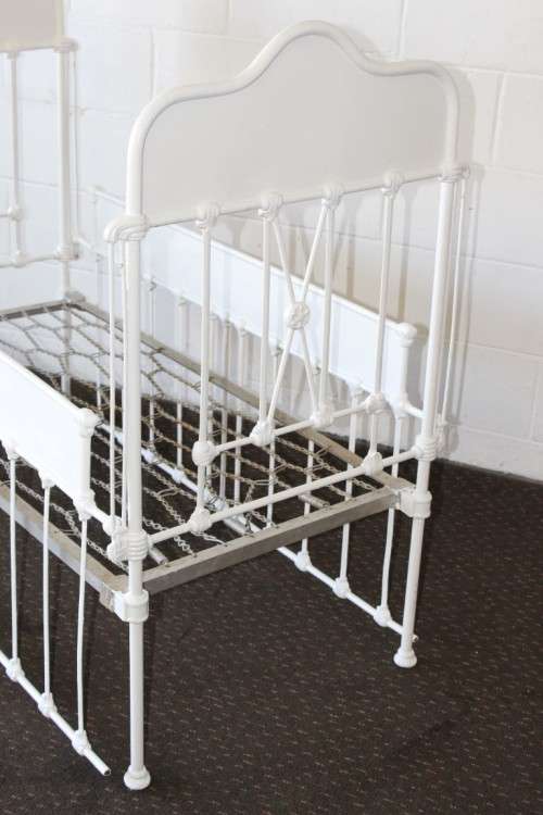 A stunning rare white painted antique late 1800 s wrought iron baby s cot with drop sides bobshop .za