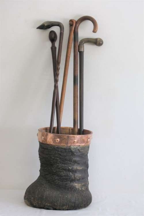 An antique (c1800's) authentic taxidermy Elephant foot umbrella stand w/ copper lining and cuff