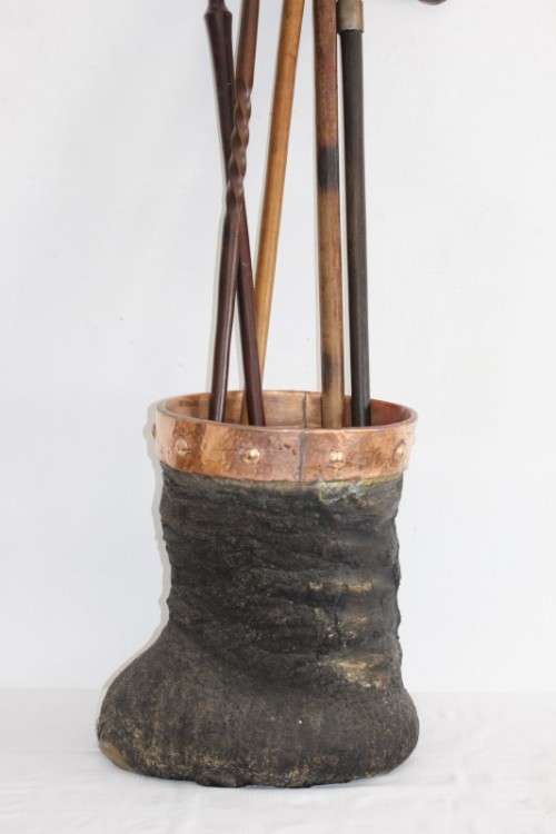 An antique (c1800's) authentic taxidermy Elephant foot umbrella stand w/ copper lining and cuff