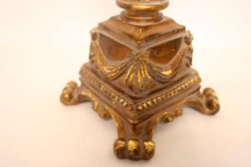 A pair of tall ornate vintage "Baroque" styled moulded resin and glass candle stick holders