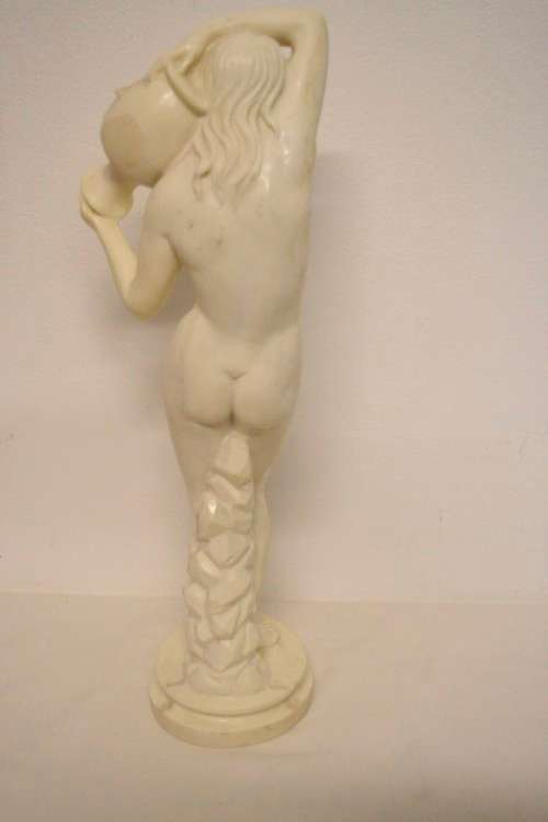A fantastic large oxylite figurine of a woman carrying a water pitcher. Beautiful on display!!