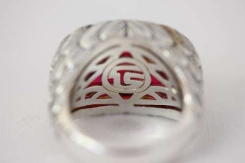 A stunning sterling silver ring with a huge faceted garnet centre stone and exquisite detailing