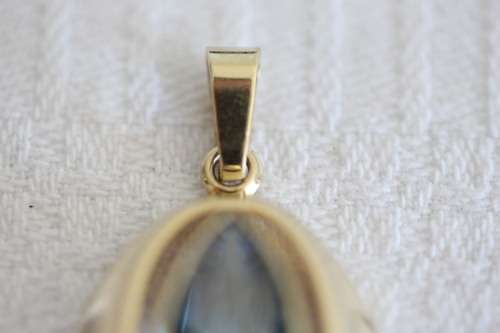 A fantastic mid-century 1950's "K&L" 9ct gold pendant w/ aquamarine center stone, made in Germany