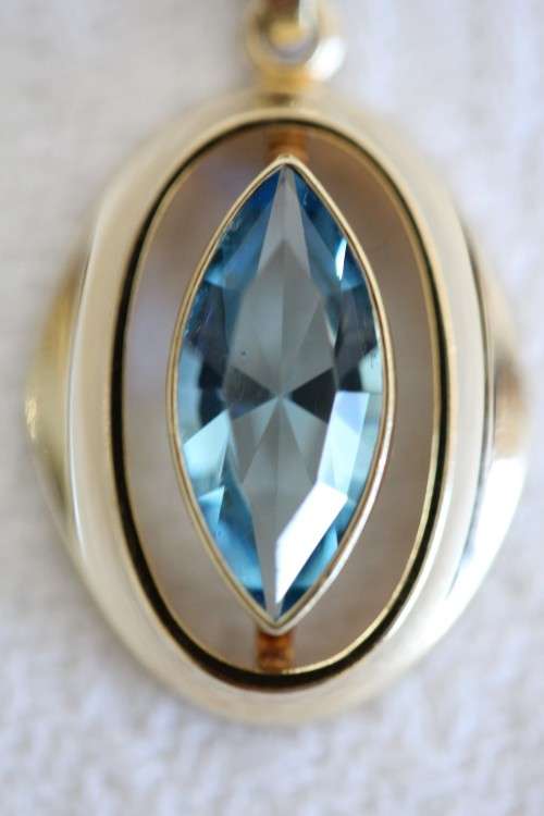 A fantastic mid-century 1950's "K&L" 9ct gold pendant w/ aquamarine center stone, made in Germany