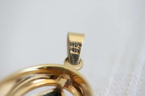 A fantastic mid-century 1950's "K&L" 9ct gold pendant w/ aquamarine center stone, made in Germany