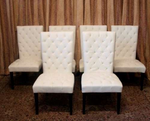 Six stunning white faux leather high-back diningroom chairs, stylish and comfortable. Price/chair