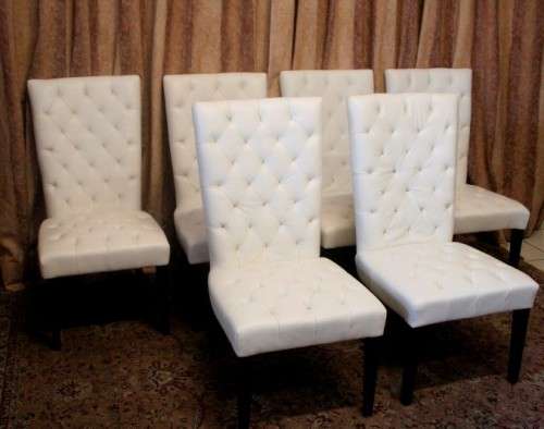Six stunning white faux leather high-back diningroom chairs, stylish and comfortable. Price/chair