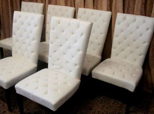 Six stunning white faux leather high-back diningroom chairs, stylish and comfortable. Price/chair