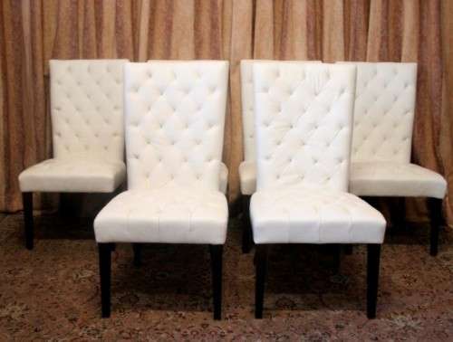 Six stunning white faux leather high-back diningroom chairs, stylish and comfortable. Price/chair