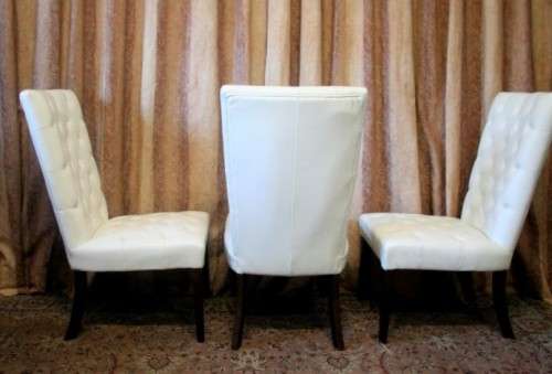 Six stunning white faux leather high-back diningroom chairs, stylish and comfortable. Price/chair