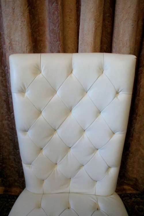 Six stunning white faux leather high-back diningroom chairs, stylish and comfortable. Price/chair