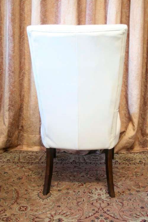 Six stunning white faux leather high-back diningroom chairs, stylish and comfortable. Price/chair