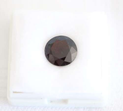 A stunning and vibrant round faceted cut 7-carat garnet semi-precious stone