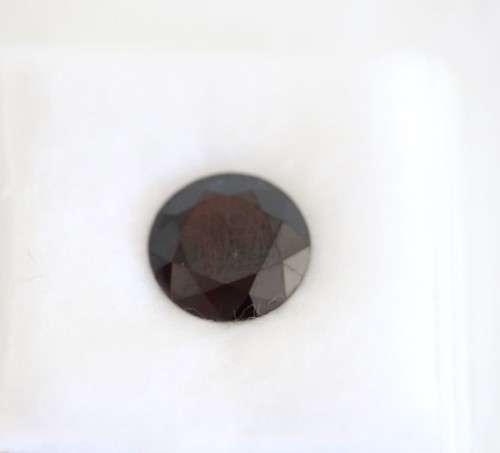 A stunning and vibrant round faceted cut 7-carat garnet semi-precious stone