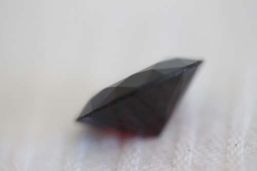 A stunning and vibrant round faceted cut 7-carat garnet semi-precious stone