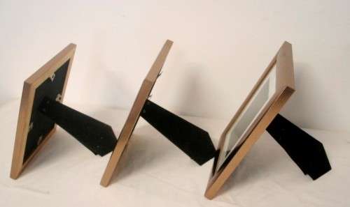**RS17** Three lovely medium sized bronze coloured free standing photo frames with glass.