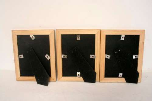 **RS17** Three lovely medium sized bronze coloured free standing photo frames with glass.