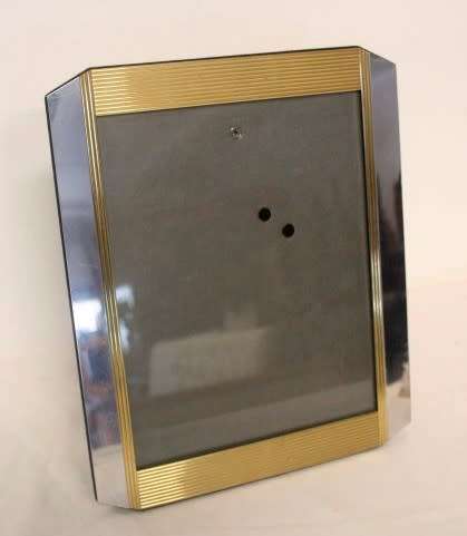 **RS17** A stunning medium sized silver and gold coloured free standing photo frame with glass.