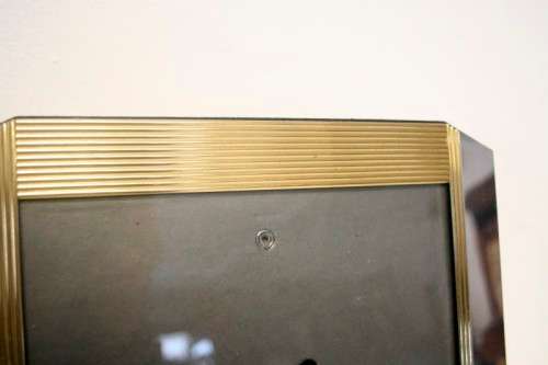 **RS17** A stunning medium sized silver and gold coloured free standing photo frame with glass.