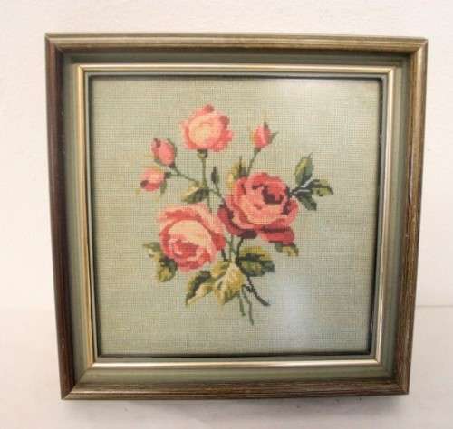 A lovely framed (behind glass) hand made tapestry of roses in great condition.