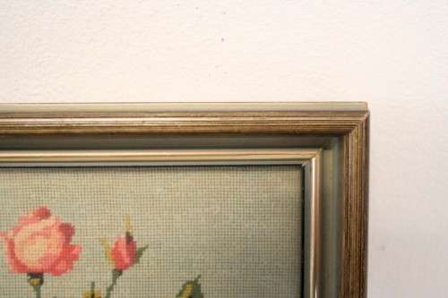 A lovely framed (behind glass) hand made tapestry of roses in great condition.