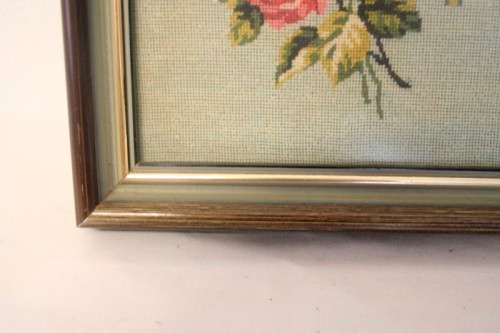 A lovely framed (behind glass) hand made tapestry of roses in great condition.