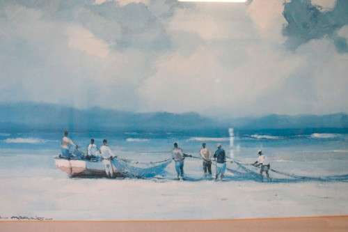 **RS17** A signed "Wessel Marais" print framed behind glass in a wood frame of fisherman with nets.