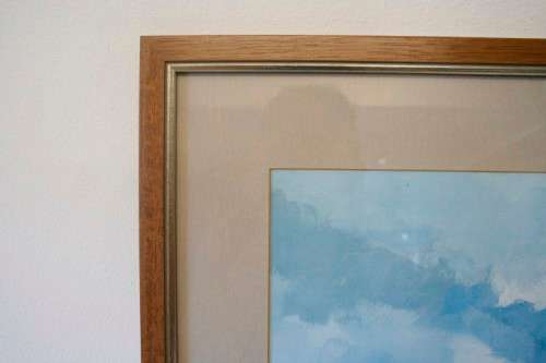 **RS17** A signed "Wessel Marais" print framed behind glass in a wood frame of fisherman with nets.