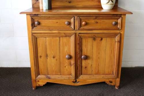 A stunning original solid Oregon 2-door server cabinet with two drawers and ample storage space