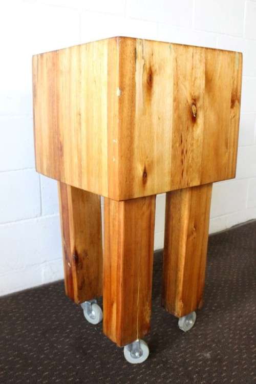 An incredible and solidly made vintage solid wooden mobile butchers chopping block on castors - wow!