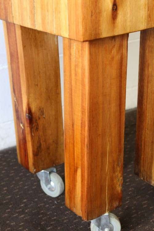 An incredible and solidly made vintage solid wooden mobile butchers chopping block on castors - wow!