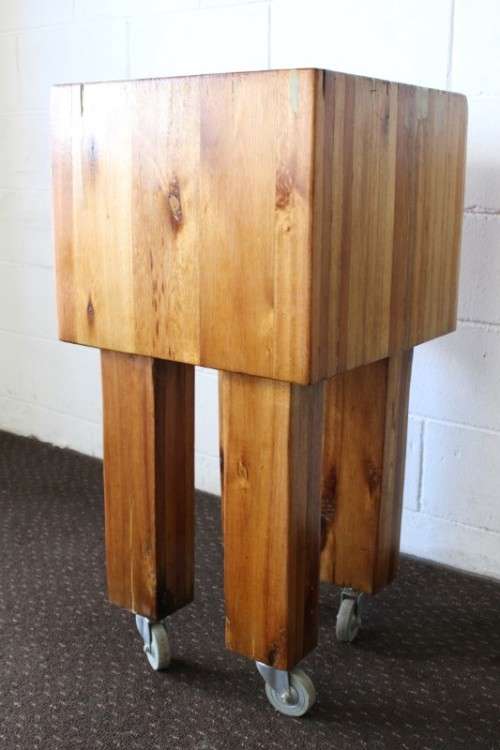 An incredible and solidly made vintage solid wooden mobile butchers chopping block on castors - wow!