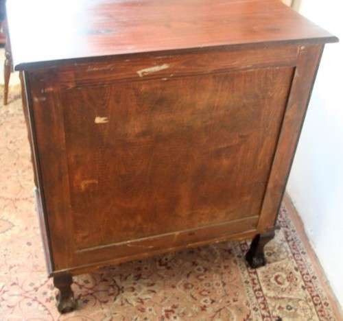 An exquisite vintage Imbuia 4-drawer chest of drawers with ornate handles and ample storage space