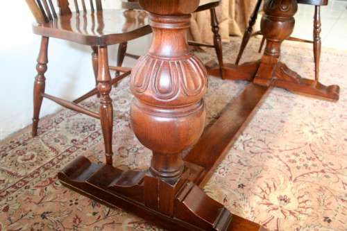 **RS17_Clearance** A solid Oak 6-seater dining room table with six Brace-back Windsor chairs