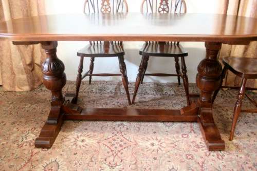 **RS17_Clearance** A solid Oak 6-seater dining room table with six Brace-back Windsor chairs