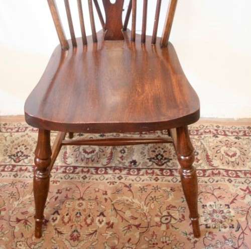 **RS17_Clearance** A solid Oak 6-seater dining room table with six Brace-back Windsor chairs