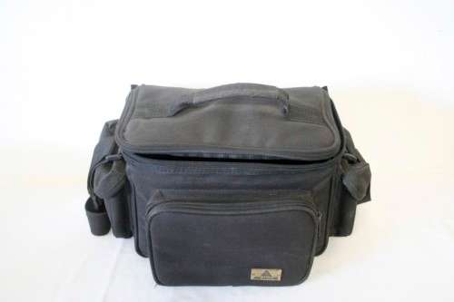 **RS17** A Pentax P30T with a Tokina Sunny 52mm lens and GX20 flash in a camera bag