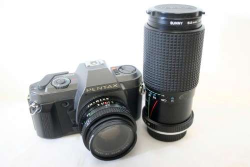 **RS17** A Pentax P30T with a Tokina Sunny 52mm lens and GX20 flash in a camera bag