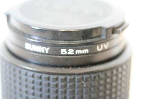 **RS17** A Pentax P30T with a Tokina Sunny 52mm lens and GX20 flash in a camera bag