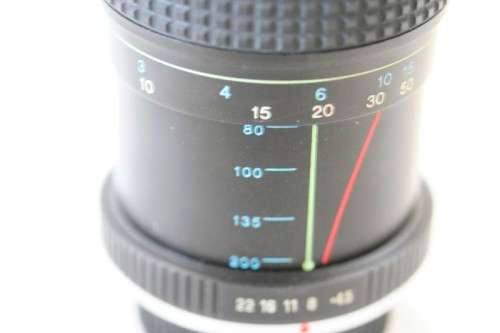 **RS17** A Pentax P30T with a Tokina Sunny 52mm lens and GX20 flash in a camera bag