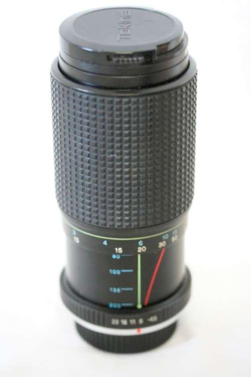 **RS17** A Pentax P30T with a Tokina Sunny 52mm lens and GX20 flash in a camera bag
