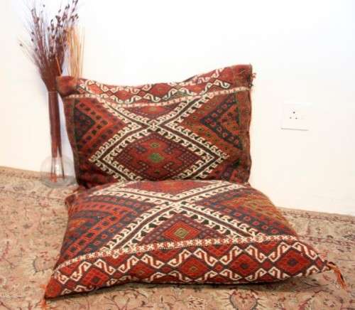A stunning top-quality colourful hand made Persian camel saddle back double cushion.