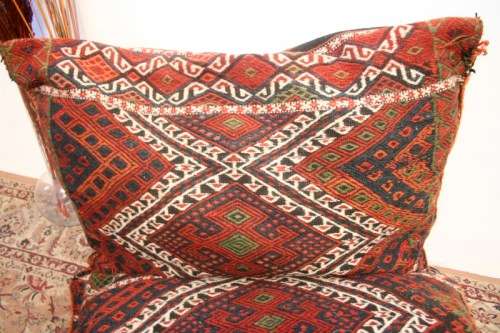 A stunning top-quality colourful hand made Persian camel saddle back double cushion.