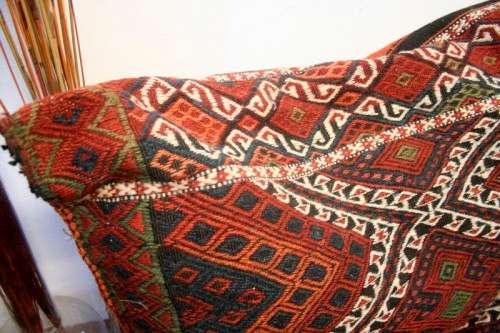 A stunning top-quality colourful hand made Persian camel saddle back double cushion.