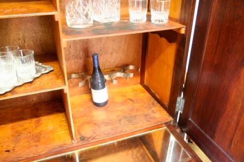 A stunning vintage Imbuia ball & claw drinks cabinet with two drawers, pull out server and shelves