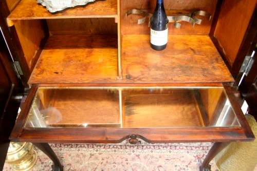 A stunning vintage Imbuia ball & claw drinks cabinet with two drawers, pull out server and shelves